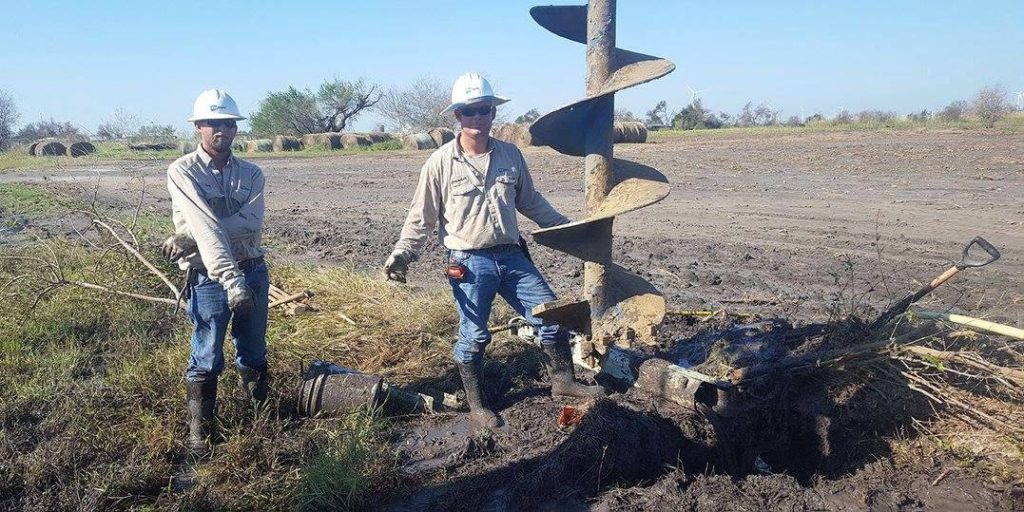 Trey Trueblood (left) and Brandon Sandmann from CoServ in Corinth show some of the heavy equipment they used to make repairs in ravaged areas of Texas. (Photo By: CoServ)