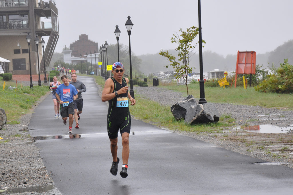 Humberto Reyna running along the James River during the 2015 Richmond Triathlon.