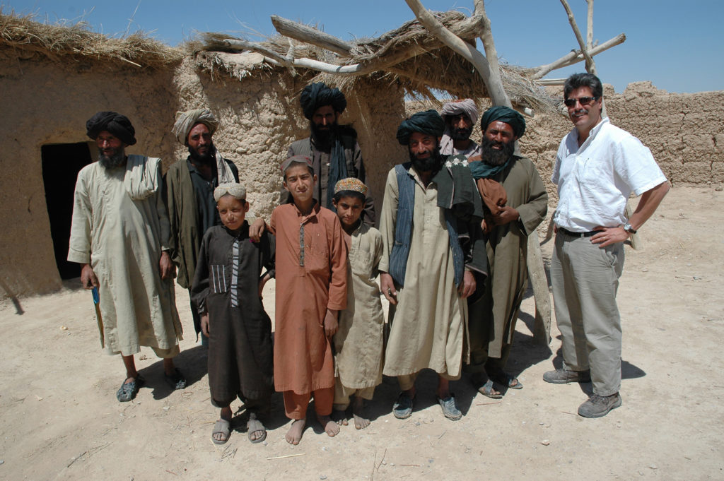 Dan Waddle, Senior VP, NRECA International, and villagers in Afghanistan, 2008.