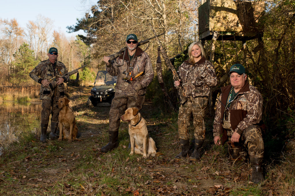 Tim Barefoot and Cutter; owner Andy Howard with Harley; daughter Holly; and Alan Pleasant at H2O Fowl Farms in Dunn, North Carolina. Duck hunt preserve.
