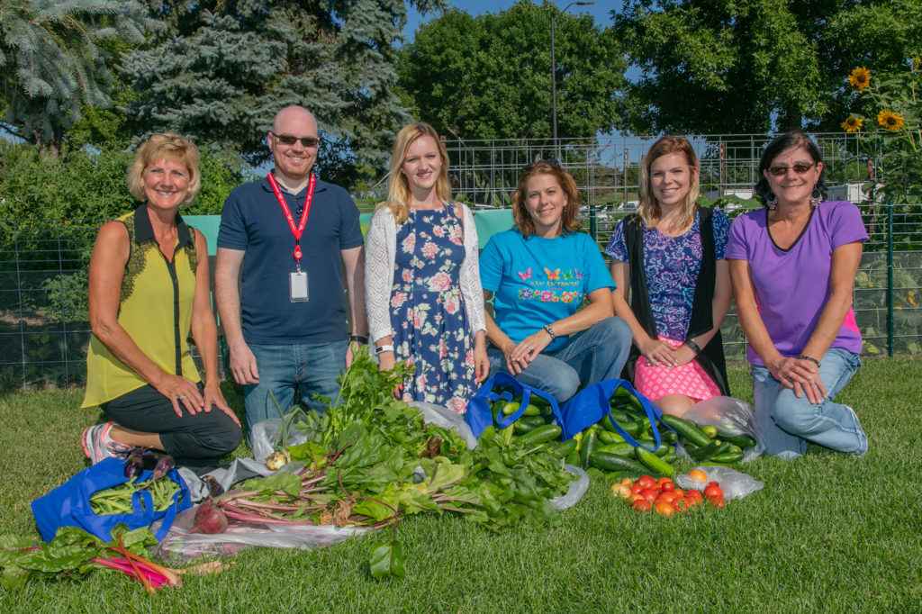 Basin Electric Power Cooperative employees display a recent summer garden haul that will help the local food pantry fight food insecurity. (Photo By: Chelsey Ciavarella)