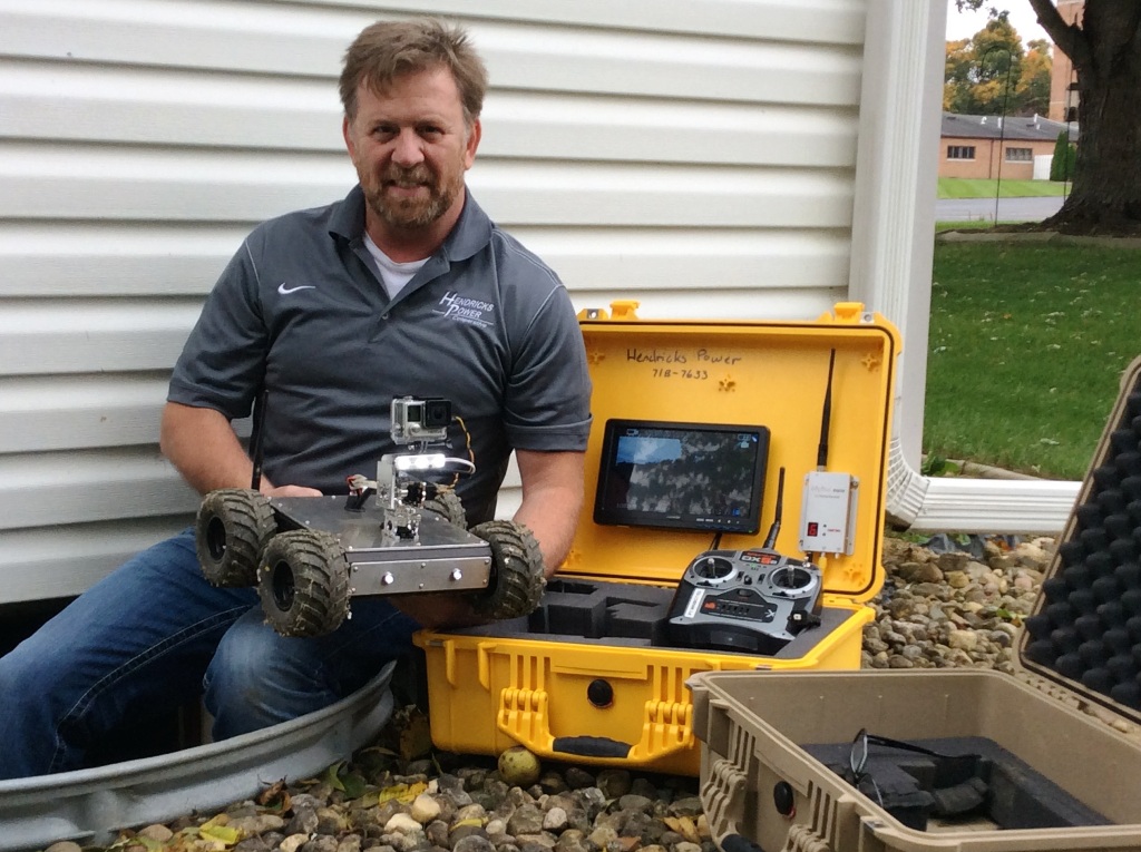 Hendricks Power’s Steve Hite now uses a custom-made robot to take the grunge out of crawl space inspections during energy audits. (Photo By: Hendricks Power)