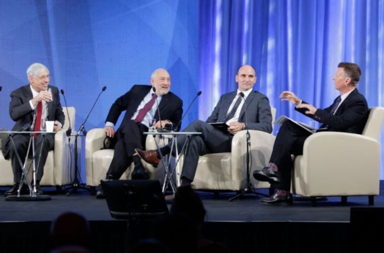 From left, business expert Mark Kramer, economist Joseph Stiglitz and Canadian official Jean-Yves Duclos discuss co-ops and the world economy with moderator Stéphan Bureau. (Photo By: Sommet International des Coopératives)