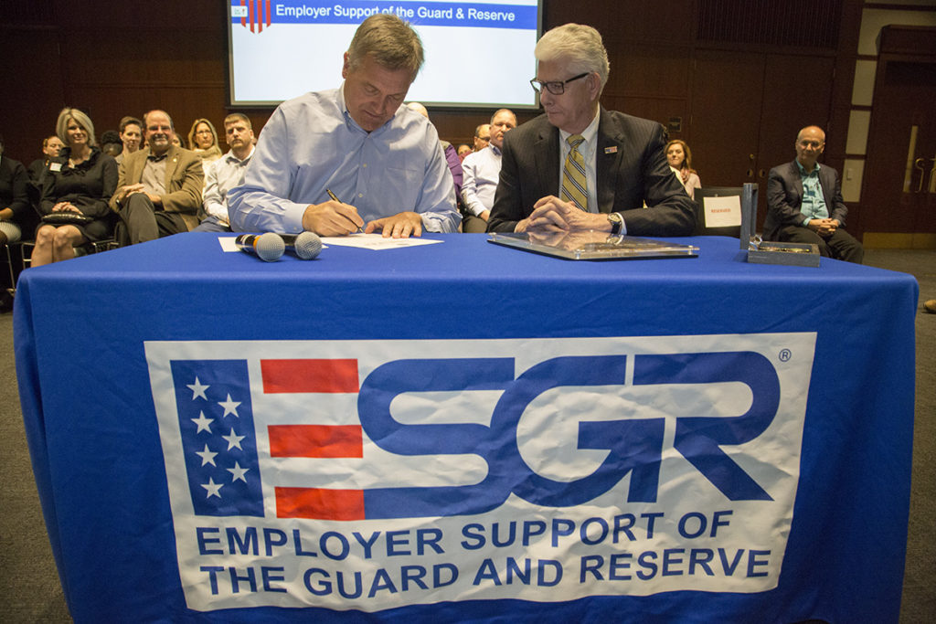NRECA ESGR (Dec. 9, 2016) –  CEO Jim Matheson signs the Employer Support of the Guards and Reserve Statement to reaffirm NRECA’s support for members of the Guards and Reserve. Jim recognized all NRECA employees who are veterans and members of the Guards and Reserve for their military service and present them with a Serve Our Co-ops; Serve Our Country Challenge Coin. With him, right, is Tom Bullock, Chief Employer Engagement Family and Employer Programs and Policy.