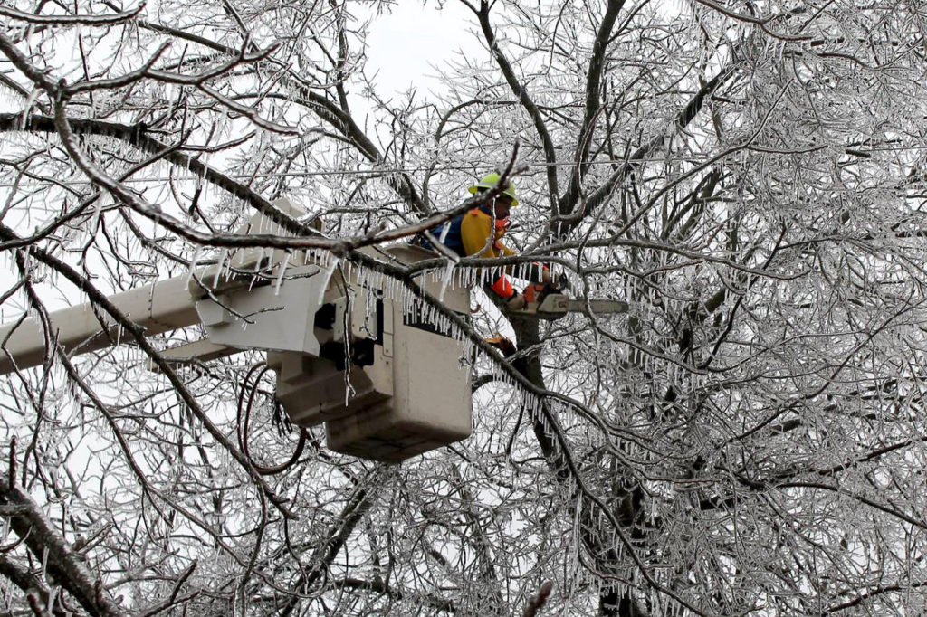 Utility crews in five states have been restoring power following ice storms across the central United States. (Photo By: Intercounty Electric Cooperative Assn.)