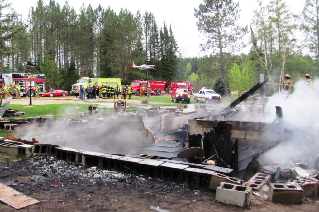 Two co-op lineworkers are being hailed as heroes for rescuing a woman from the wreckage of this Minnesota home following an explosion. (Photo By: Lisa Rosemore/Grand Rapids Herald-Review)