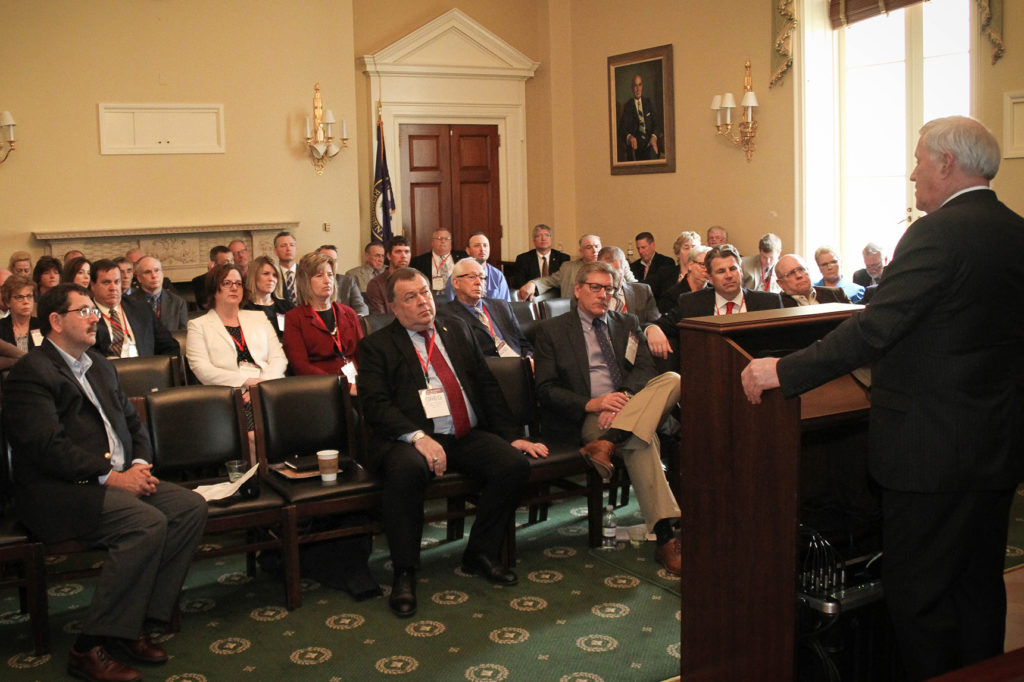 Some of the 60 co-op leaders from Minnesota surround Rep. Collin Peterson in the Longworth House Office Building. (Photo By: Luis Gomez Photos)