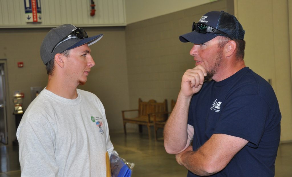 Nate Humphrey (r) swaps lineman ideas with Ryan Hewitt of Community Electric Cooperative. They attended the Power Line Worker School together in 2016. Southside Electric hired Humphrey while Community Electric hired Hewitt. (Photo By: Bill Sherrod/VMDAEC)