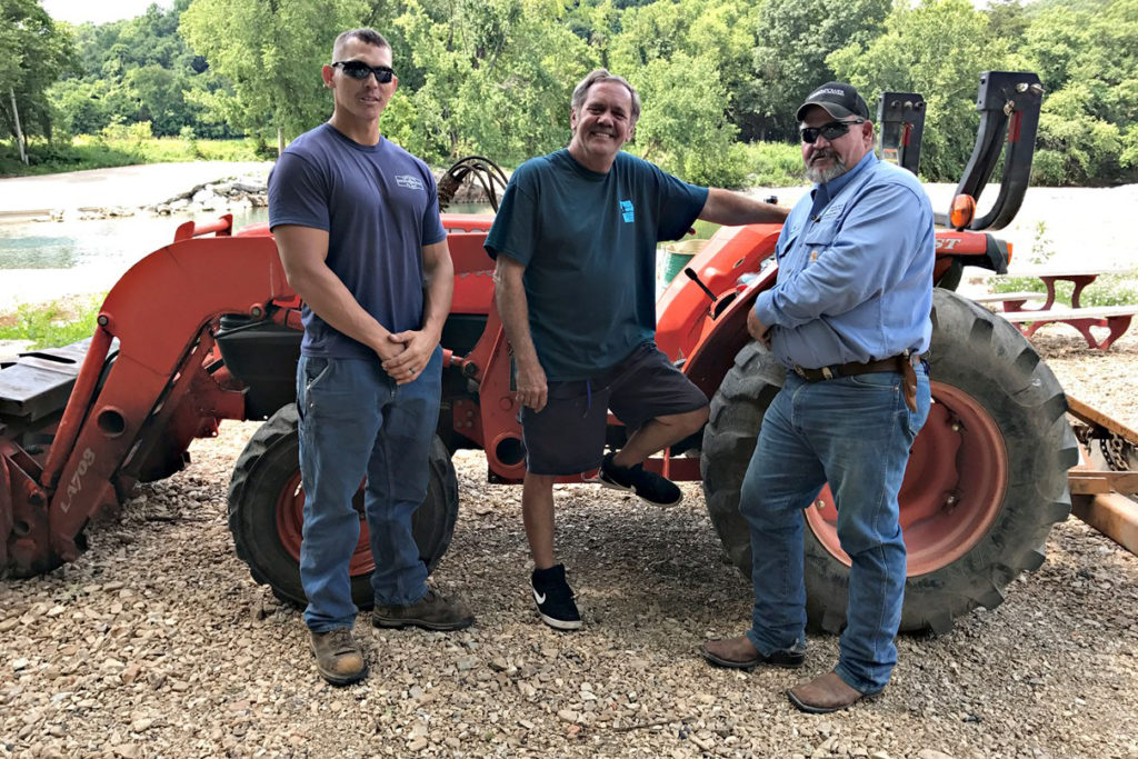 New-Mac Electric Co-op member Mike McClain (c) believes linemen Kyle Scott (l) and Bob Harris kept him from losing his foot. (Photo By: Josh King/New-Mac EC)