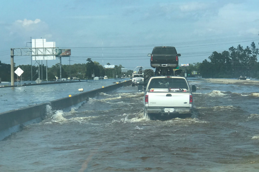 Members of the Cajun Navy and other volunteers are working beyond both ends of this section of Interstate 10 closed by river flooding near Port Arthur, Texas (Photo By: John Billiot/Cajun Navy)