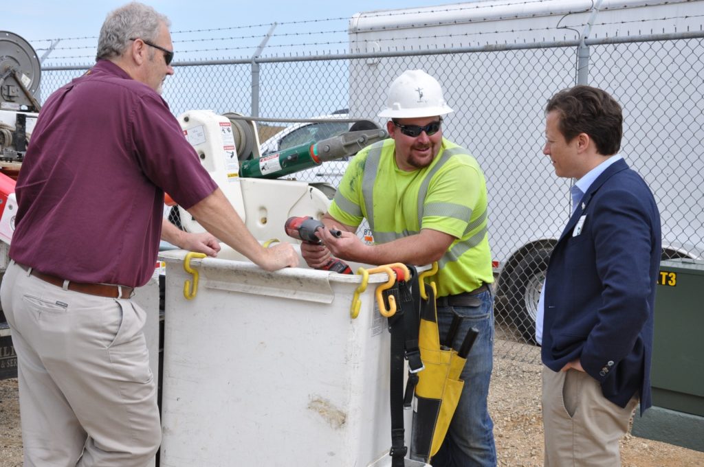 (L-R) Ken Miller, ACEC safety manager and Garin Gavinski, journeyman lineman, chat with Power Africa’s Andrew Herscowitz. (Photo By: Adams-Columbia Electric Cooperative)