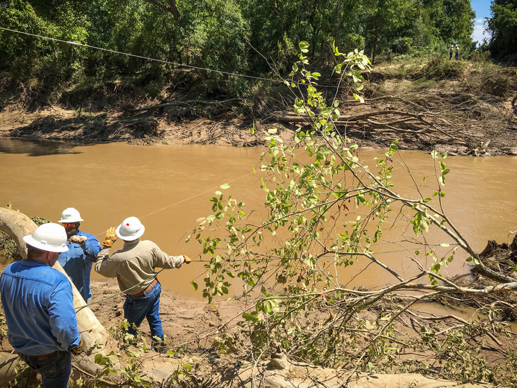 Bluebonnet Electric Co-op crews use a drone to fly rope across the San Marcos River to speed repairs. (Photo By: Sarah Beal, Bluebonnet EC)