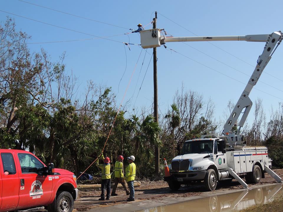 Workers bring back power to some of the 20,000 meters in Florida Keys Electric Co-op's territory still without electricity. (Photo By: FKEC)