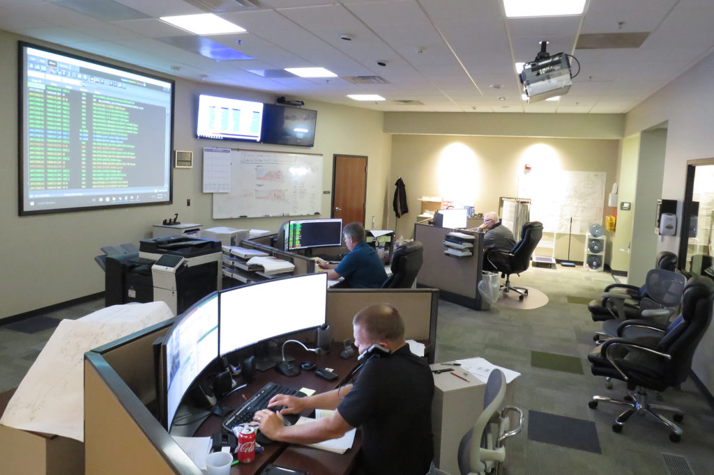 Control room operators at Peace River Electric Cooperative, monitor service as repairs to the co-op's distribution system continue. (Photo By: Mark Sellers, PRECO)