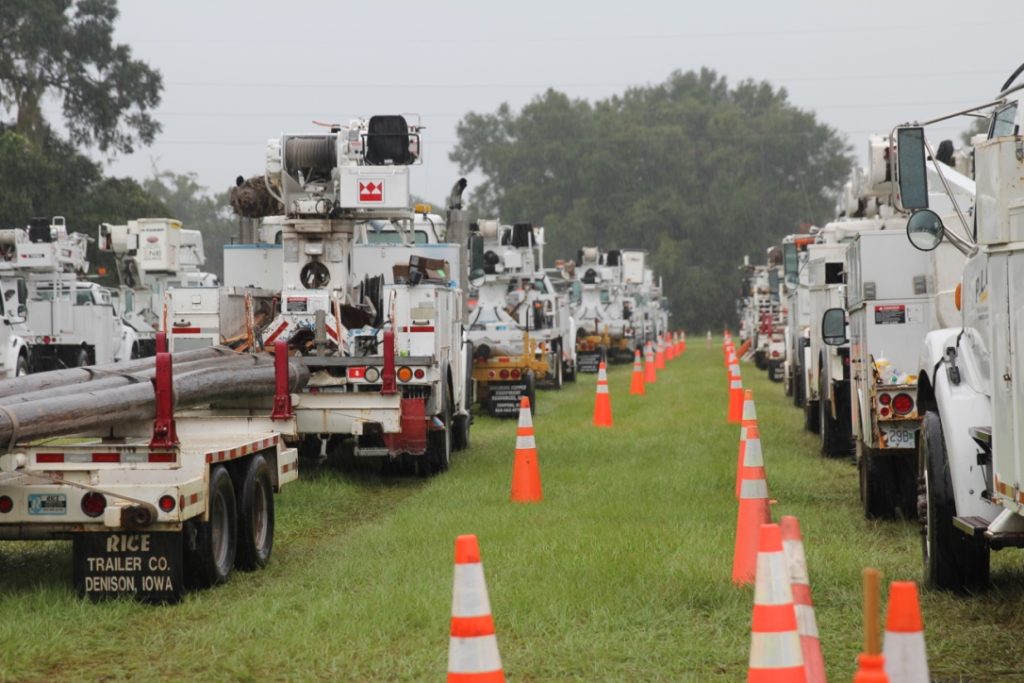 Co-op trucks, loaded with equipment are staged on high ground to begin restoring power in the service territory of Sumterville, Florida-based SECO Energy. (Photo By: SECO Energy)