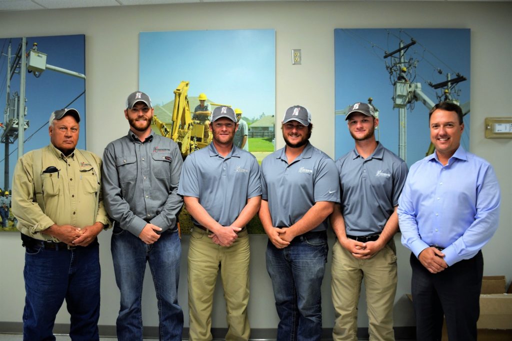 (L-R) Southern Pine Electric’s Rodney Buckelew, Greg Meadows, Brett Dew, Trey Serio and Parker Vincent are congratulated by CEO Jason S. Siegfried. (Photo By: Brock Williamson)