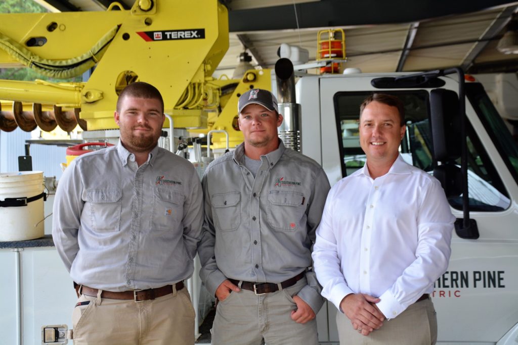 (L-R) Tyler White and Colby Ezell earn the thanks of CEO Jason S. Siegfried. (Photo By: Brock Williamson)