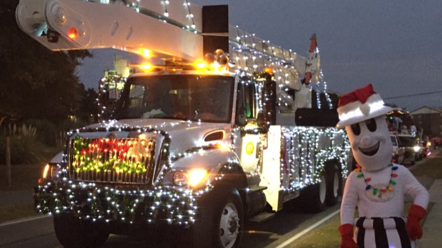 Willie Wiredhand and a Horry Electric Cooperative bucket truck get into the holiday spirit. (Photo By: Annette Harris)