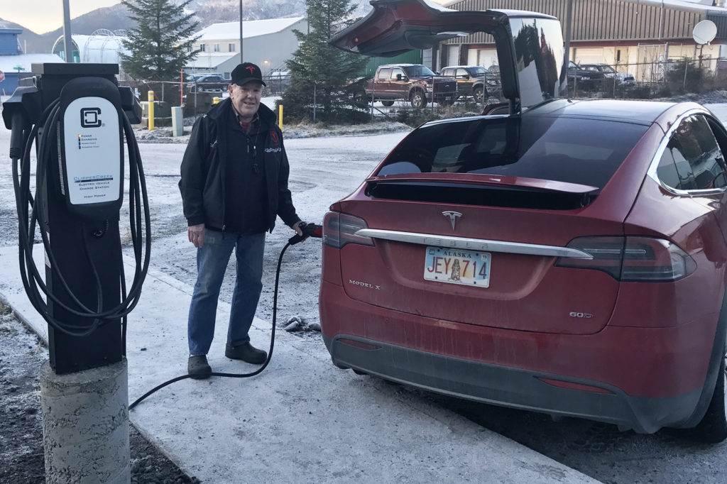 John Harvill, a Cordova Electric Cooperative member, charges his Tesla at a new station the co-op and city installed. (Photo Courtesy of Clay Koplin)
