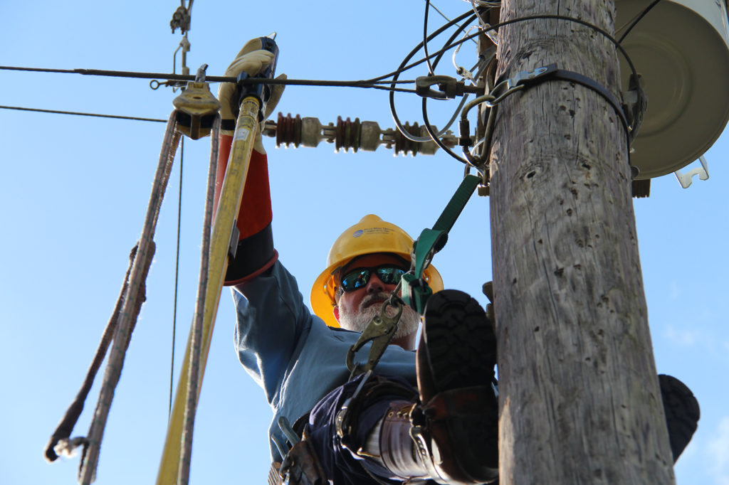 Peace River Electric Cooperative service technician Buddy J. Mongiovi, pictured in 2017, spent the second half of the Super Bowl restoring power to PRECO members in Nalcrest, Florida. (Photo By: PRECO)