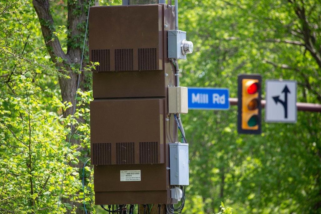 Control units, back-up batteries and other support equipment connected to 5G broadband antenna arrays is installed beneath power lines, and could restrict climbing access. (Photo By: Denny Gainer/NRECA) 