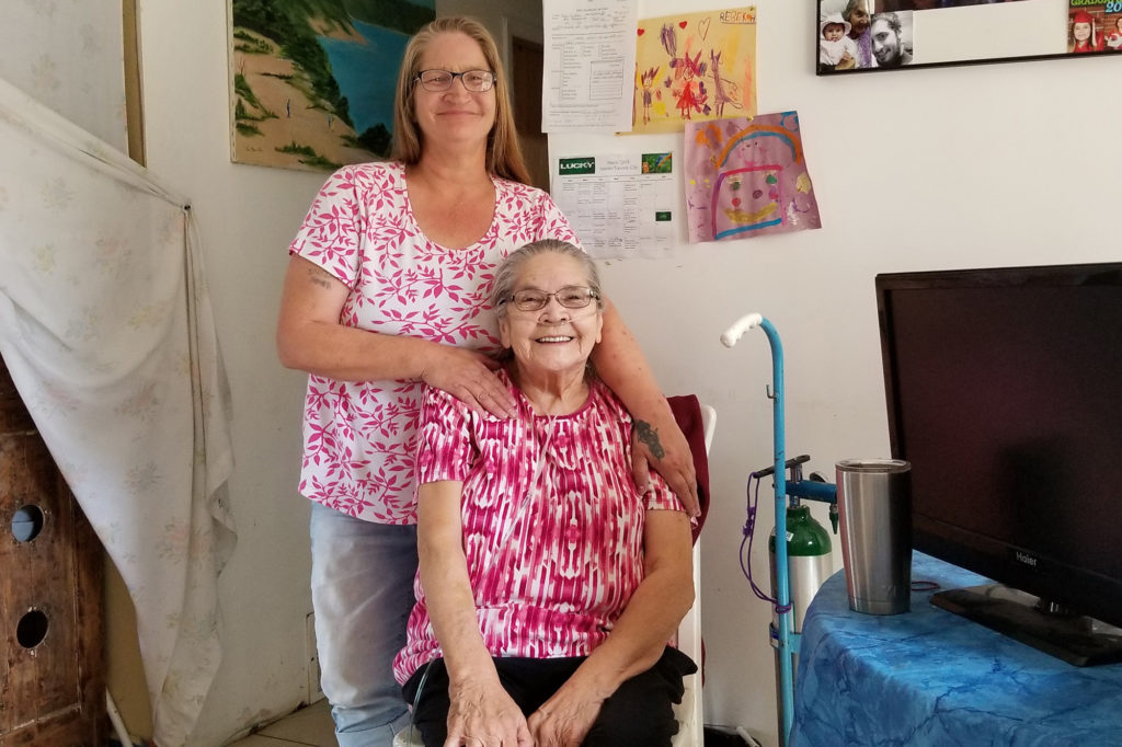 Ruby Ogemagegedo and her daughter, Brenda, are paying less for electricity by participating in Cherryland Electric Cooperative’s community solar program for low-income members. (Photo By: Robert Marsh/Cherryland EC)