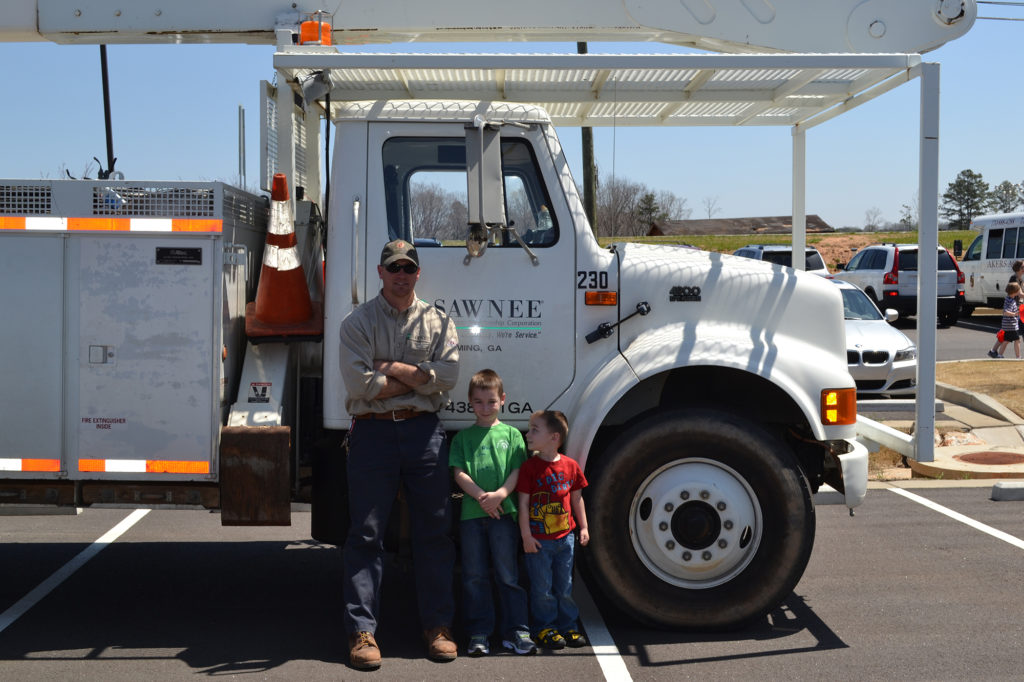 Making sure co-op members of all ages are satisfied, like these youngsters at Touch a Truck Day, helped Sawnee EMC get top marks in the 2018 J.D. Power study. (Photo By: Sawnee EMC)