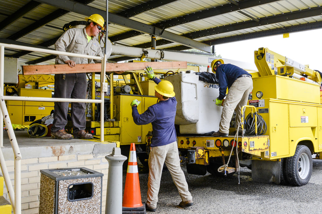 Staffers from Rappahannock Electric Cooperative load crossarms and other equipment into trucks at a service center in preparation for Hurricane Florence restoration work. (Photo By: Rappahannock EC) 