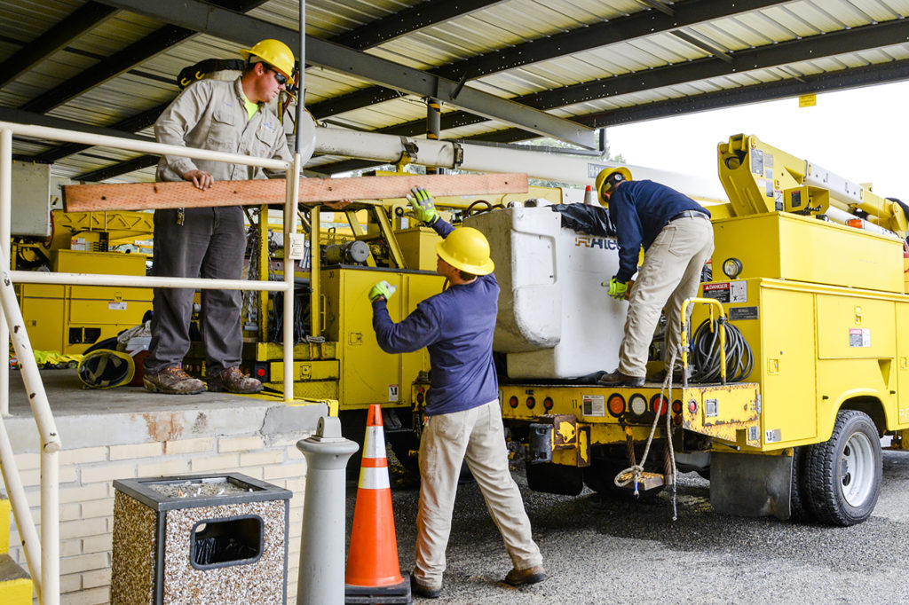 Staffers from Rappahannock Electric Cooperative load crossarms and other equipment into trucks at a service center in preparation for Hurricane Florence restoration work. (Photo By: Rappahannock EC)