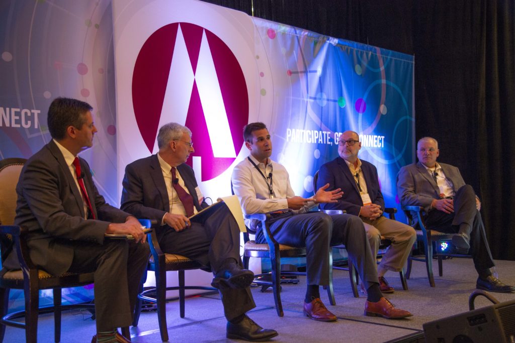 NRECA COO Jeffrey Connor (far left) moderates a panel on rural broadband with (l-r) Russell Tucker, NRECA economist; Mike Keyser, CEO, BARC Electric; Lynn Hodges, CEO, RCEC; and Bryon Stilley, CEO, Chariton Valley Electric, at the 2018 Co-op IMPACT Conference. (Photo By: NRECA/Alexis Matsui)