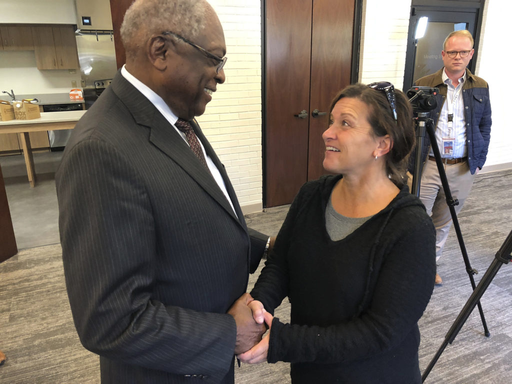 Rep. Jim Clyburn, D-S.C. (left), congratulates Aiken Electric Cooperative consumer-member Janet Murphy on the energy savings she’s now receiving as a result of energy efficiency upgrades made possible by an Aiken EC Help My House loan. (Photo By: Electric Cooperatives of South Carolina) 