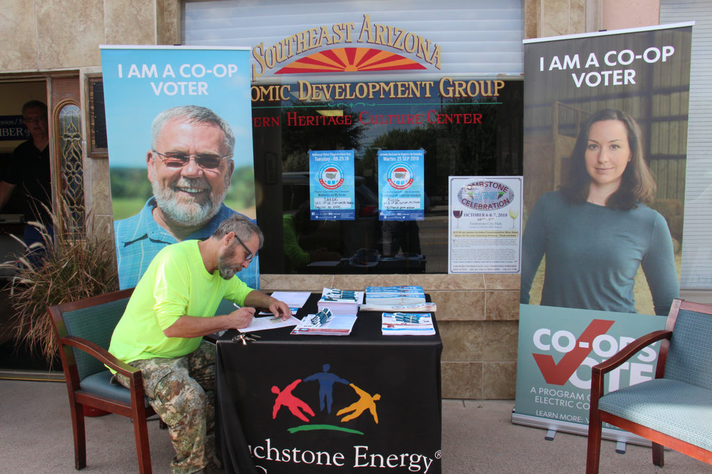 Sulphur Springs Valley Electric Cooperative member Tony Vincent shows why voting is important at a National Voter Registration Day booth in Benson, Arizona. (Photo By: Geoff Oldfather)