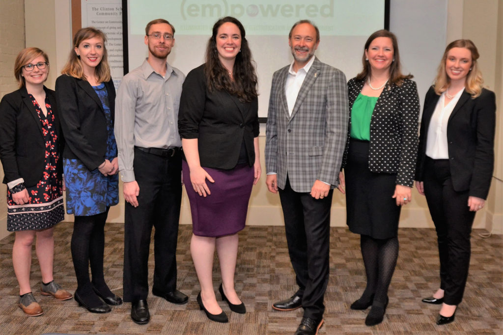 Lori Burrows and Duane Highley (center) of Arkansas Electric Cooperatives worked with Clinton School of Public Service graduate students on a video promoting cooperation to meet community challenges such as rural broadband. (Photo By: AECC)