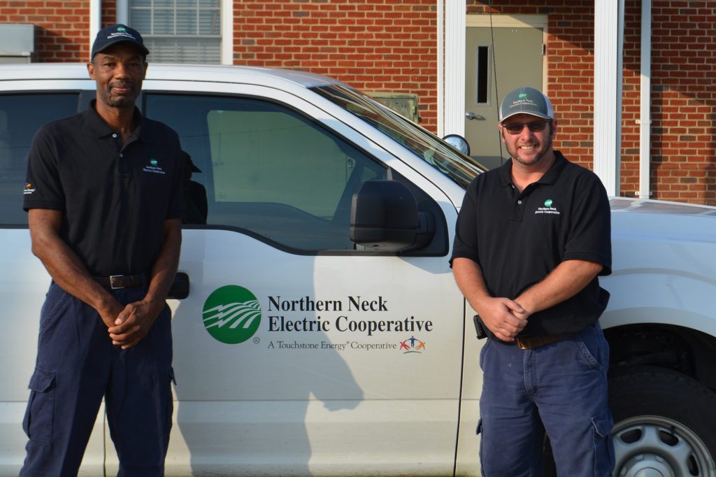 (L-R) NNEC lineworkers James Kelly and Craig Loving came to Helen Mitchell’s aid during a fierce thunderstorm. (Photo By: NNEC)