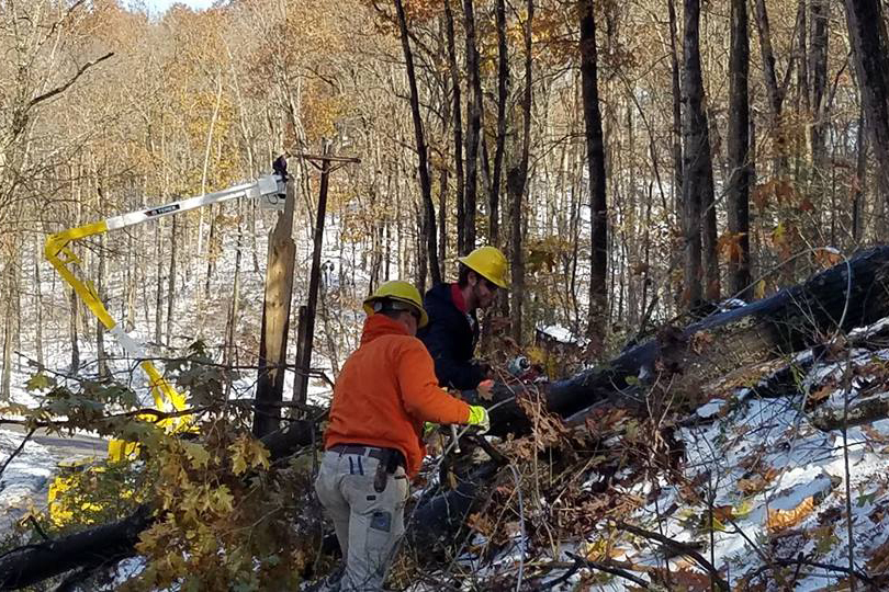 Rappahannock EC line technicians Patrick Ambrose and JR Smith work to rebuild damaged co-op lines following a Nov. 15 ice storm in the Blue Ridge Mountains near Culpeper, Virginia. (Photo By: Rappahannock EC)