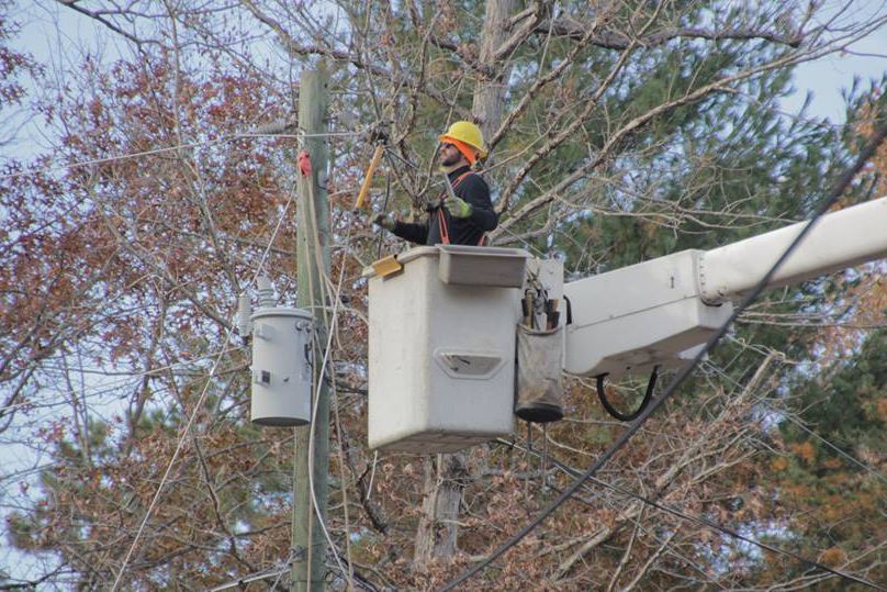 Rappahannock Electric Cooperative journeyman line technician Nathaniel Pennell makes repairs following a Nov. 15 ice storm in the Blue Ridge Mountains near Culpeper, Virginia.  (Photo By: Rappahannock EC)