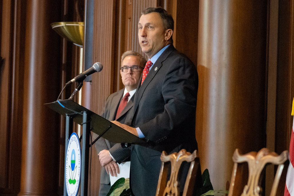 NRECA’s Kirk Johnson addresses a gathering where acting EPA Administrator Andrew Wheeler (left) unveiled a proposal to replace current power plant standards requiring coal capture technology. (Photo Credit: EPA)
