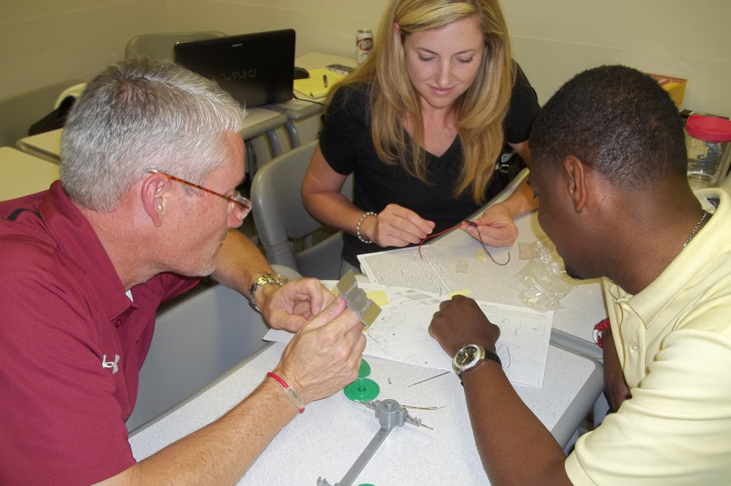 South Carolina teachers in a summer course at the University of South Carolina in Columbia build a solar car, one of the classroom activities in EnlightenSC. (Photo Courtesy of ECSC)