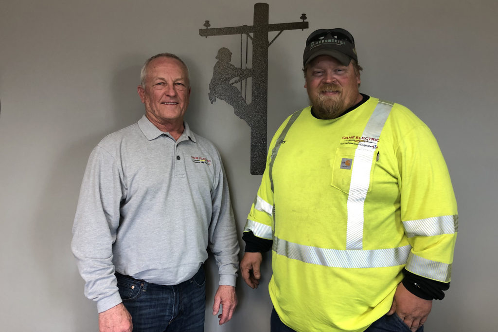 Oahe EC General Manager and CEO Rodney Haag and journeyman line technician Torry Smith made sure a state trooper survived a frigid South Dakota blizzard. (Photo By: Oahe EC)