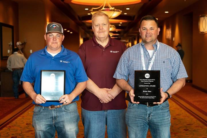 Jacob McPherson, left, and Brian Sims, right, of Farmers Electric Cooperative in Greenville, Texas, received statewide Lifesaving Awards in March. Warren Huggins, middle, is the co-op’s safety specialist. (Photo: Courtesy of Texas Electric Cooperatives)