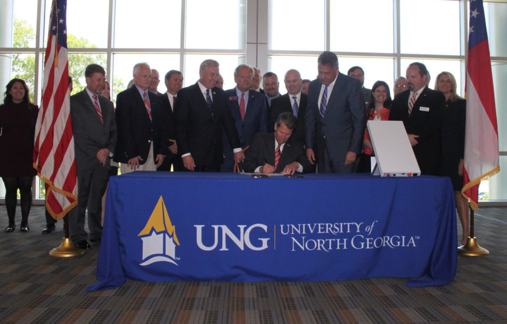 Electric co-op leaders were among those on hand as Georgia Gov. Brian Kemp signed a law clarifying co-op authority to pursue broadband services. (Photo Courtesy of Georgia EMC)