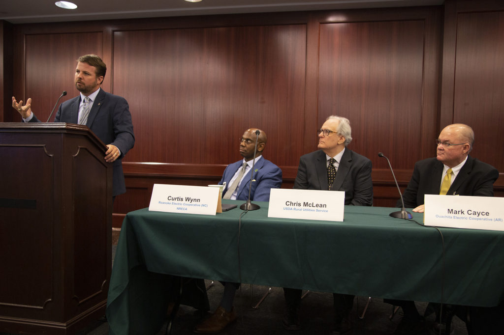 Chad Lowder, CEO of Tri-County Electric Cooperative in St. Matthew, South Carolina, speaks at a Capitol Hill briefing on energy efficiency alongside (left to right) NRECA President Curtis Wynn, USDA Assistant Administrator Chris McLean, and Ouachita Electric Cooperative General Manager Mark Cayce. (Photo By: Dennis Gainer/NRECA)