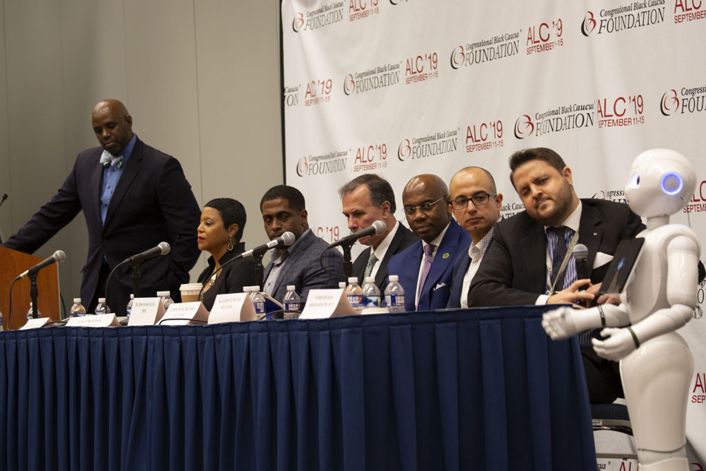 NRECA President Curtis Wynn talked about artificial intelligence during a panel discussion by energy experts at the Congressional Black Caucus Foundation’s 2019 legislative conference. One of the “guests” was Pepper the robot. (Photo By: Alexis Matsui)