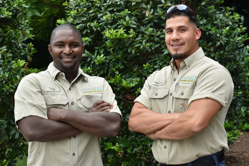 NOVEC’s Troy Price (l) and Mauricio “Mo” Paz outside the Manassas, Virginia, co-op’s headquarters. (Photo By: Emily Ready)