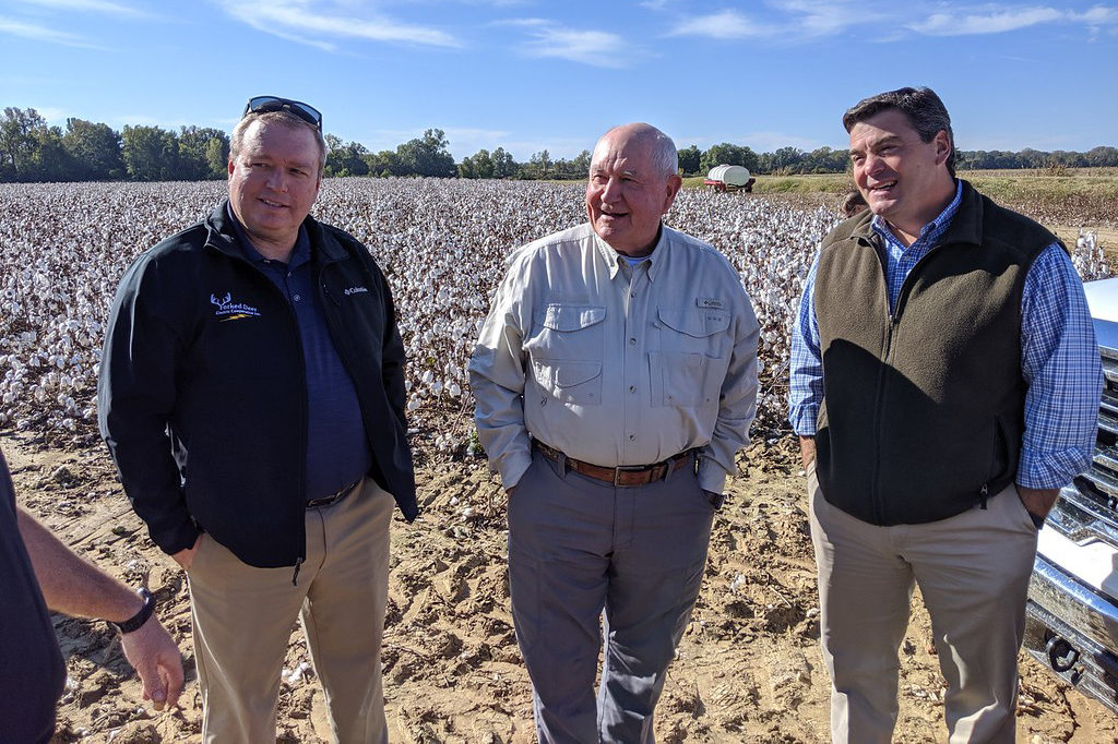 Forked Deer CEO Jeff Newman, Agriculture Secretary Sonny Perdue and Ray Hurt of Hurt Seed Co. Inc. toured cotton fields where farmers will be able to use advanced equipment when the co-op uses its ReConnect grant to deploy broadband in western Tennessee. (Photo By: TECA)