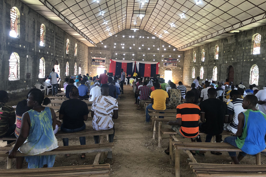 Members of the Totota Electric Cooperative in Liberia attend the co-op’s annual meeting. (Photo By: NRECA International)