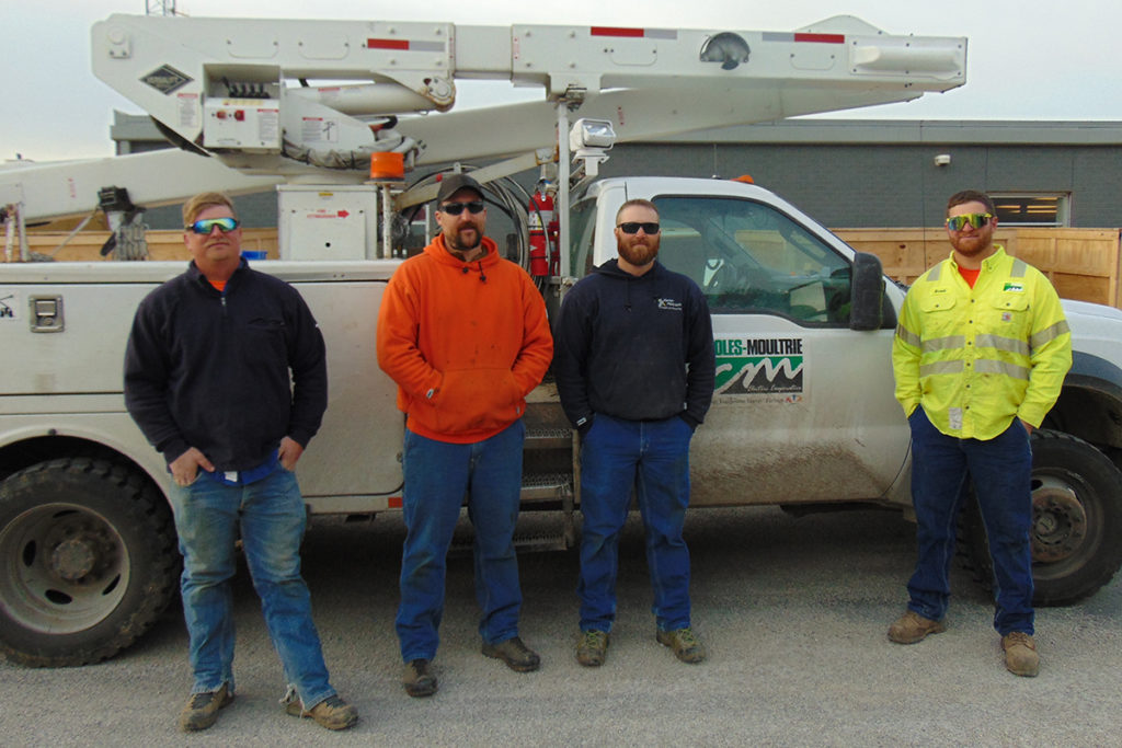 A quick, skilled response by employees at Coles-Moultrie Electric Co-op helped save the life of a Vietnam War veteran at his home in Casey, Illinois. From left: Mitch Stanciu, Bob Schafer, Jim Geldert and Brock Cook.  (Photo By: Carla Bradbury/Coles Moultrie)