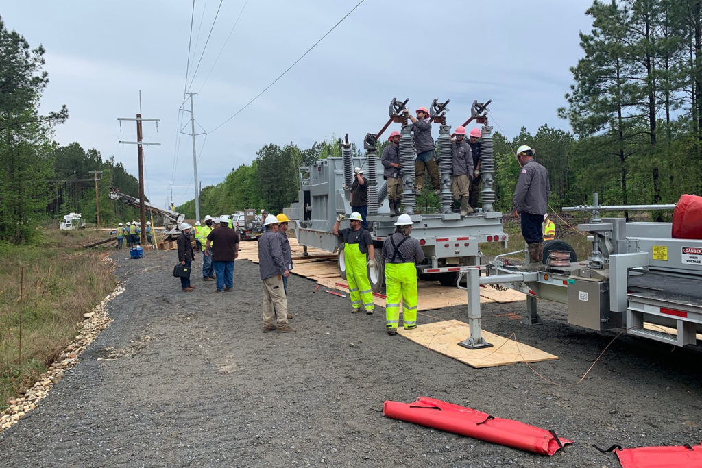 More than 50 crews helped transport and assemble a mobile substation. Work that normally would have taken up to a month was planned, engineered and completed in four days. (Photo By: AECI) 