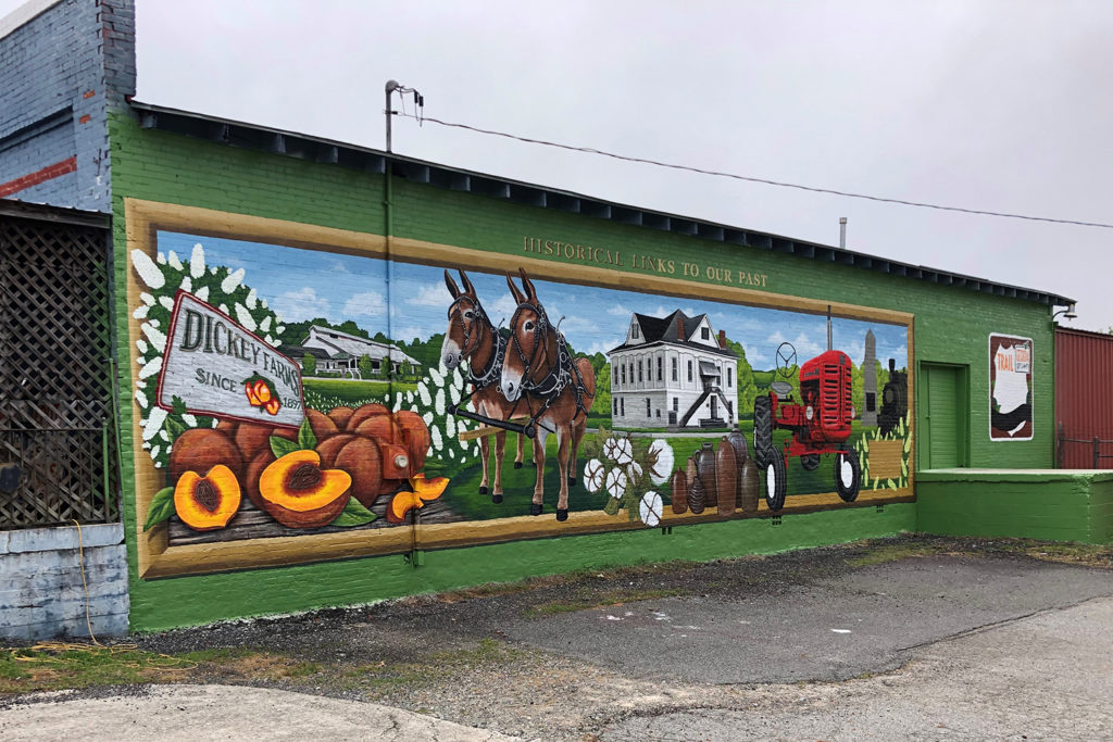 Artist Chris Johnson wraps up work on “Historical Links to Our Past” in mid-May. (Photo By: Chris Johnson)