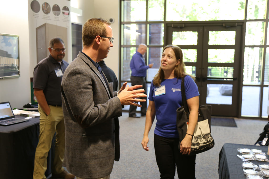 Hoosier Energy’s Blake Kleaving, left, talks with a participant at last fall’s Electrify Indiana! conference that focused on beneficial electrification modes and technologies. (Photo By: Hoosier Energy)